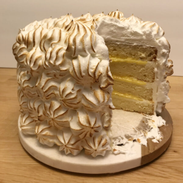 A cake that has been cut into four layers.