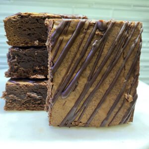 A close up of some brownies on a plate