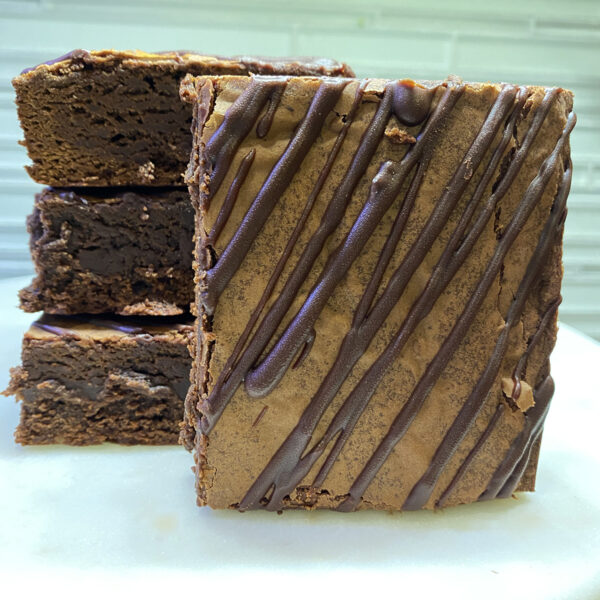 A close up of some brownies on a plate